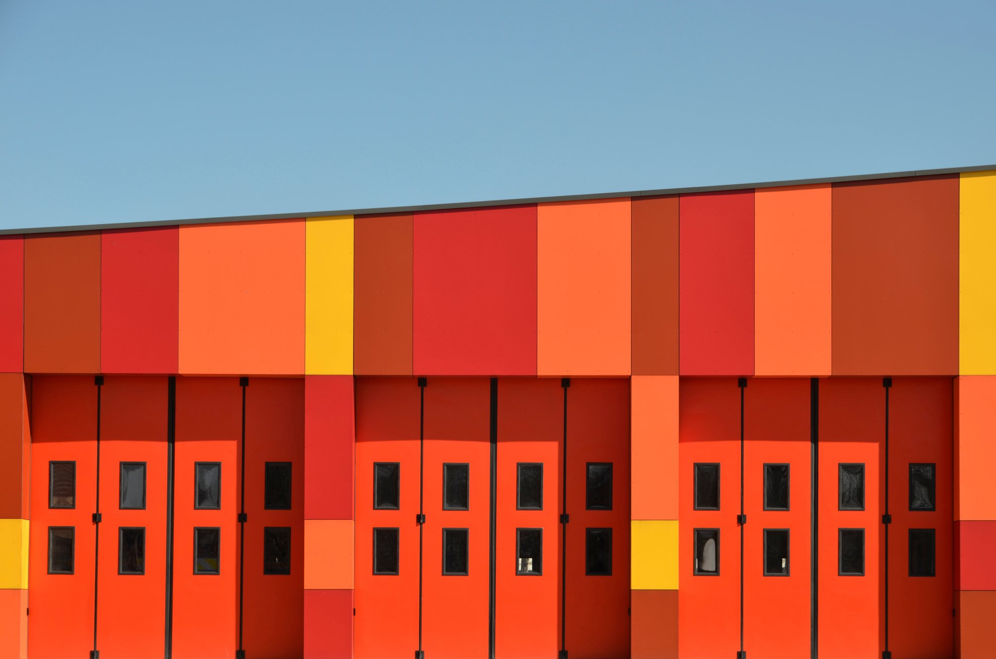 Red building against blue sky